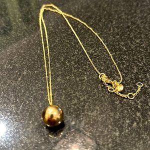 Long gold necklace